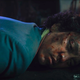 His face dirty and bloody, Spike Spiegel (John Cho) lies on the ground after a long hard season.